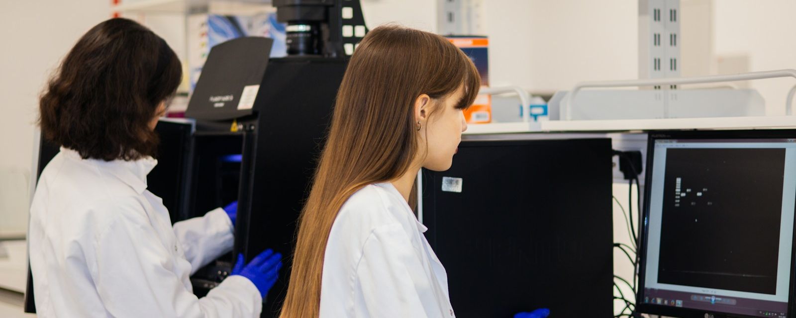 Scientists working on computerised laboratory systems